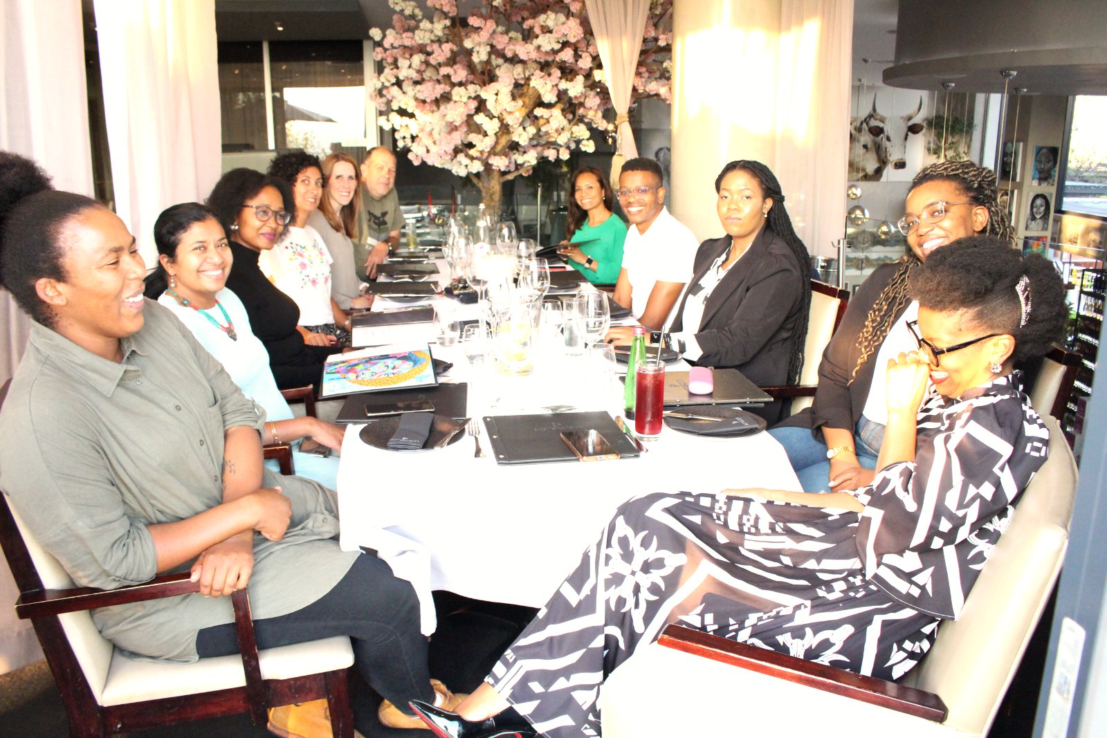 The team around a long table at the management luncheon